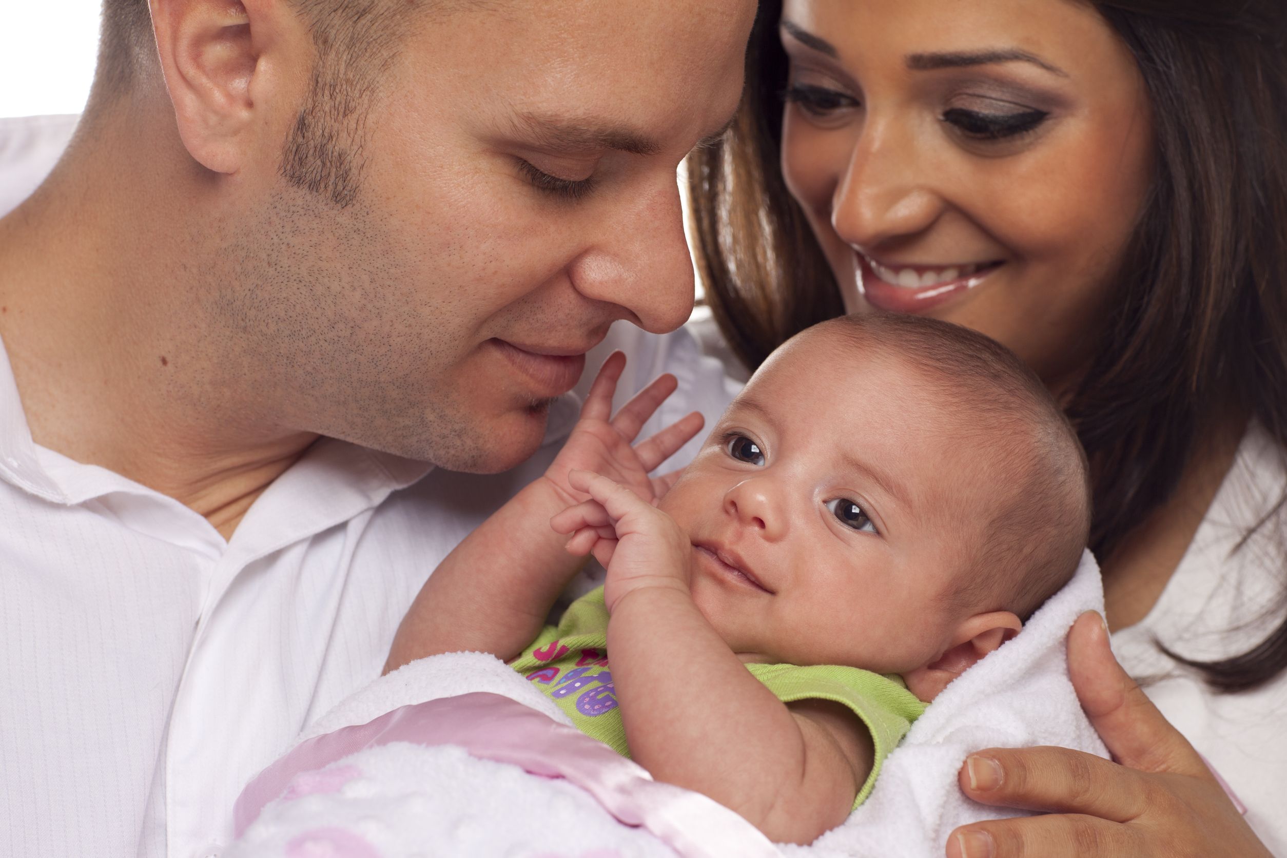13561659 – happy young attractive mixed race couple with newborn baby.